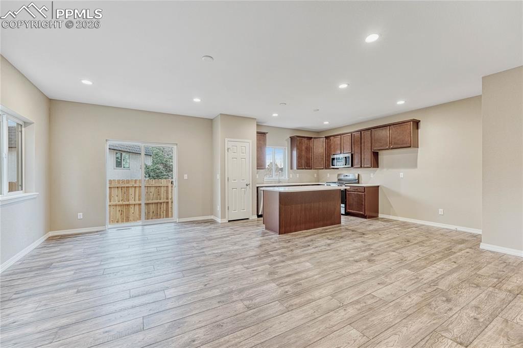 Image 10 of 34: Dining area walks out to fully fenced backyard. Seamlessly move gatherings