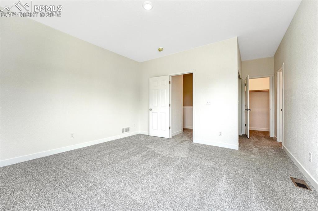 Image 13 of 34: A walk-in closet and secondary closet provide ample space for your wardrobe