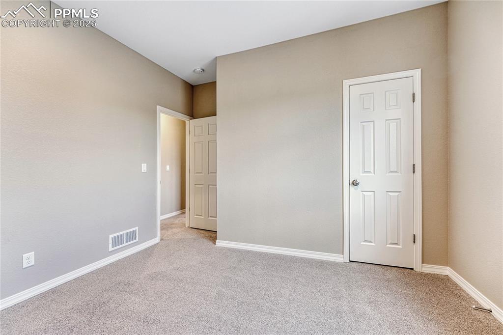 Image 17 of 34: Choose the carpet and paint for both bedrooms!