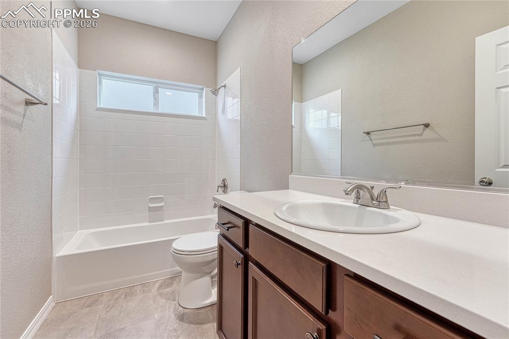 Image 18 of 34: A full bathroom serves the secondary bedrooms. Your choice of finishes with