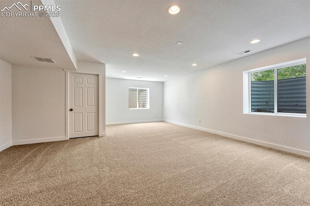 Image 21 of 34: Imagine all the ways to use this space: home theatre, game room, gym, play