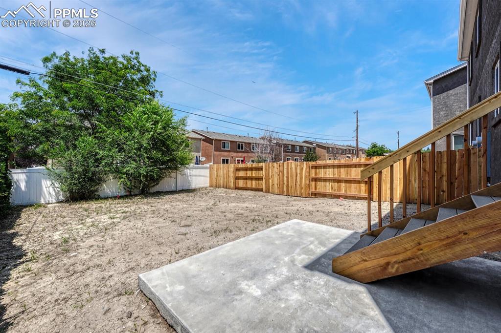 Image 26 of 34: Landscaping and auto sprinklers are included.