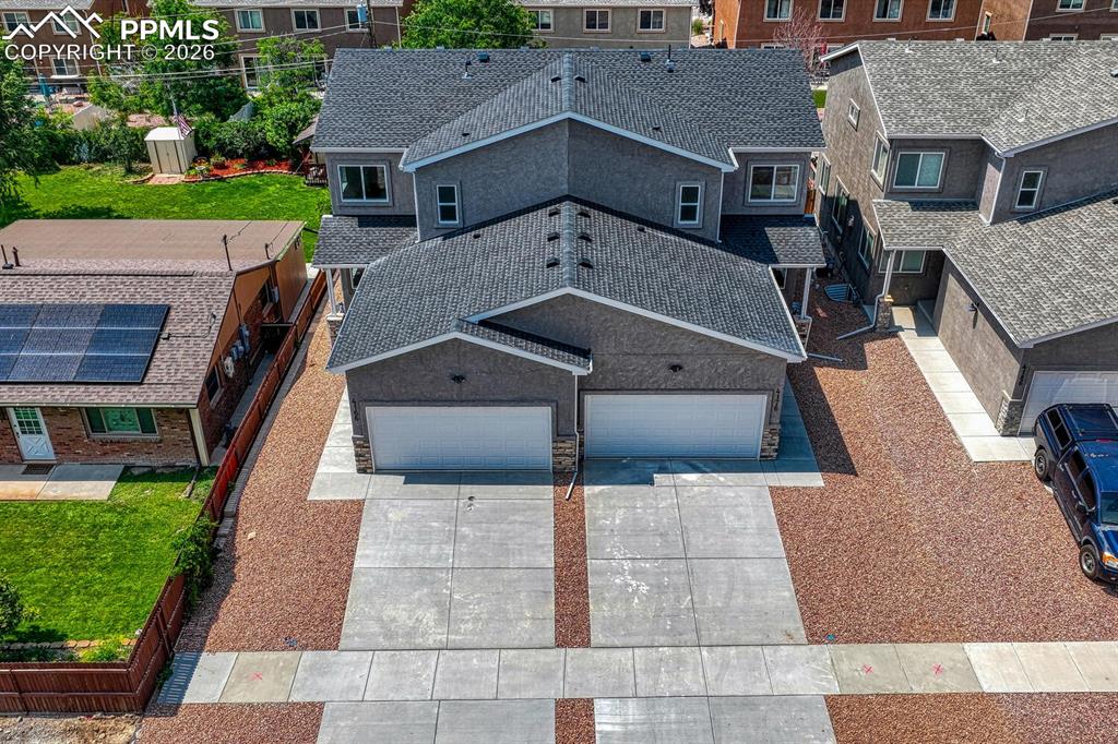 Image 30 of 34: Attached 2 car garage comes equipped with automatic garage door opener.
