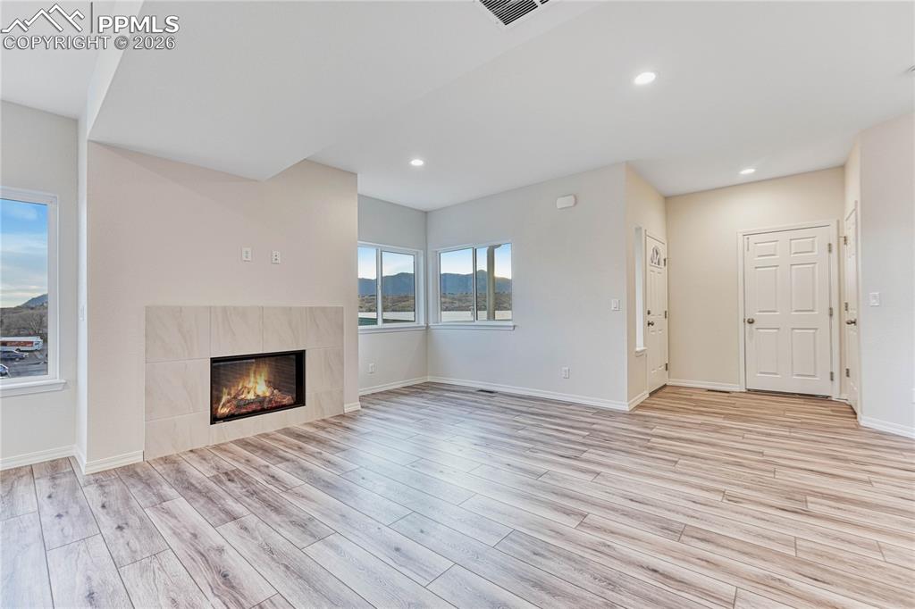 Image 4 of 34: 9 ft airy ceilings with your choice of durable and long lasting LVP. Choose