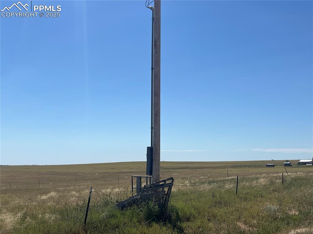 Caption: View of yard featuring a view of rural / pastoral area