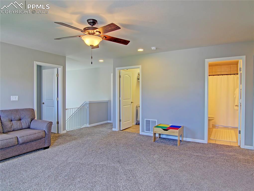 Image 21 of 44: Playroom featuring light colored carpet, recessed lighting, and ceiling fan