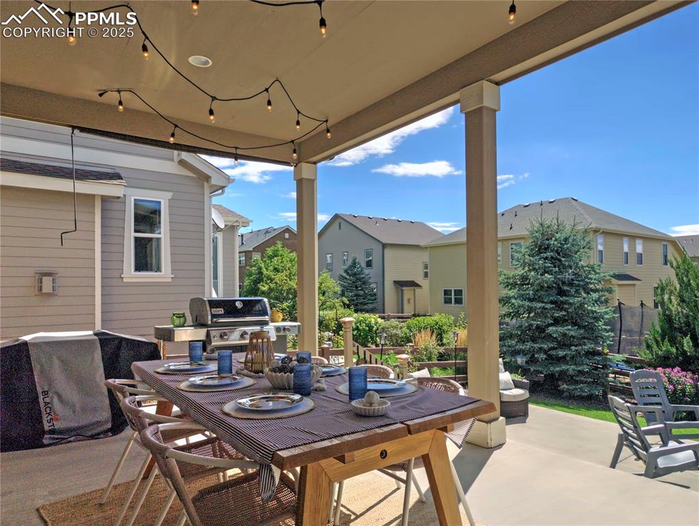 Image 35 of 44: View of patio / terrace with outdoor dining area and a grill