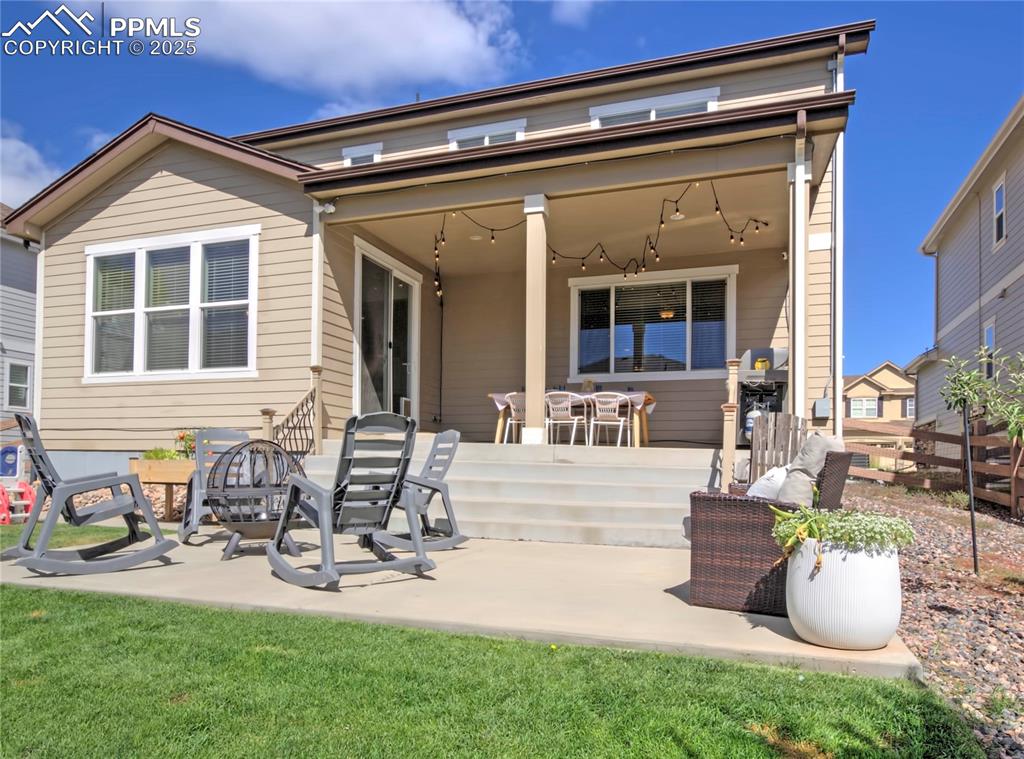Image 36 of 44: Rear view of property featuring a patio and a yard