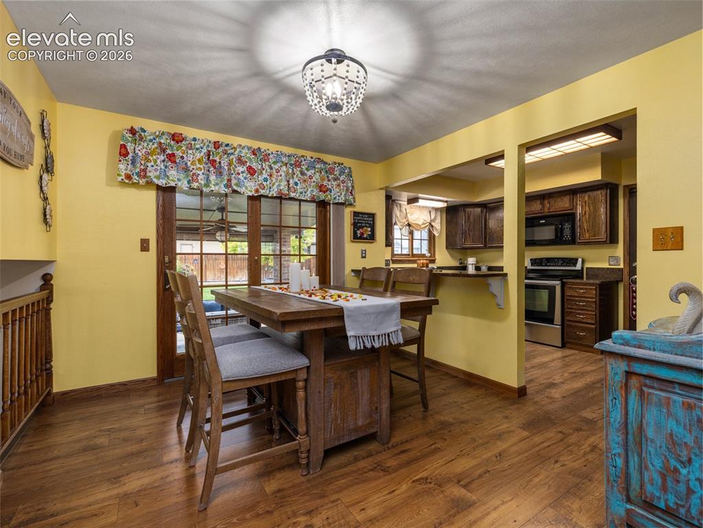 Image 6 of 34: Wood-finish flooring throughout