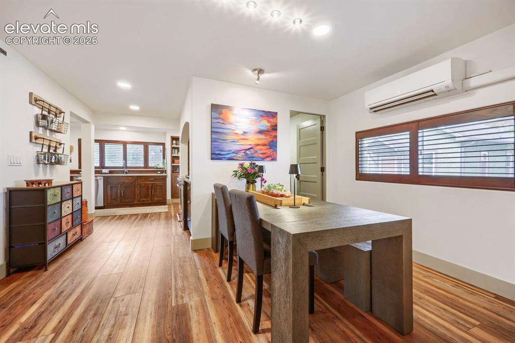 Image 10 of 30: Wood-finish flooring throughout