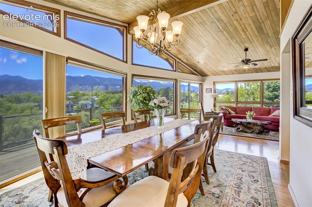 Image 12 of 50: Dining room can expand into living room. This table has extended to hold 22