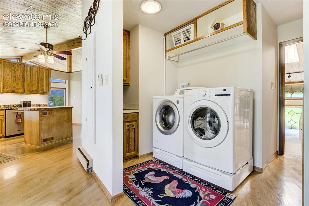 Image 17 of 50: Laundry is right around the corner of the kitchen.