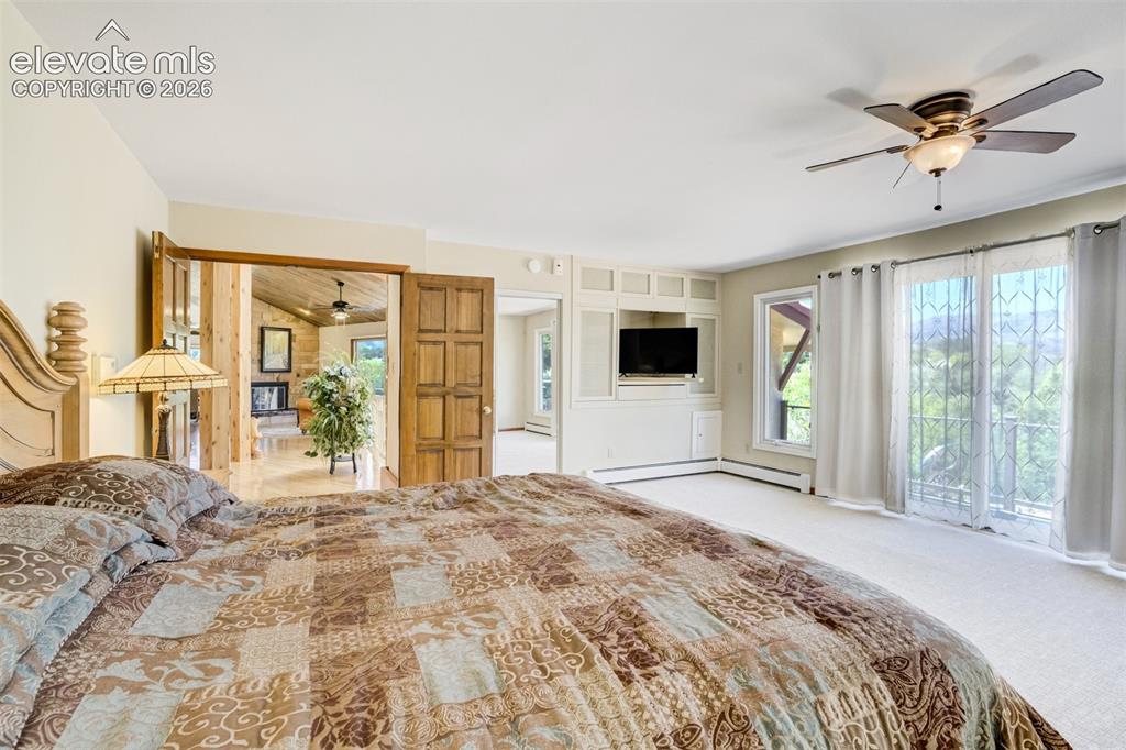 Image 24 of 50: Primary bedroom has French Doors off the entry foyer.
