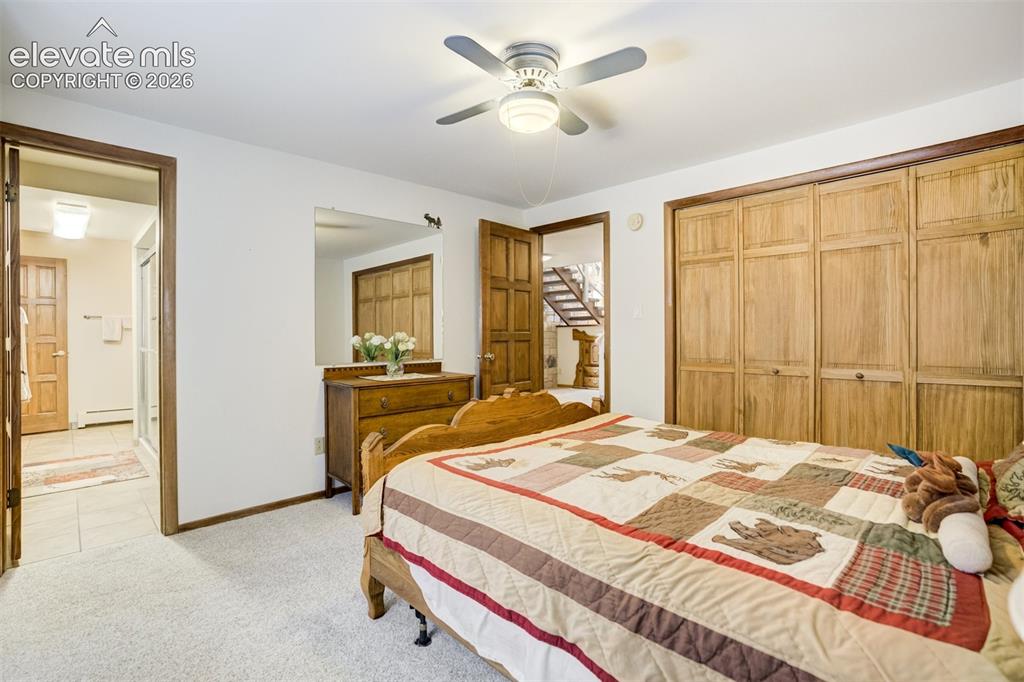 Image 39 of 50: Bedroom 4 in lower level, with adjoining bath.