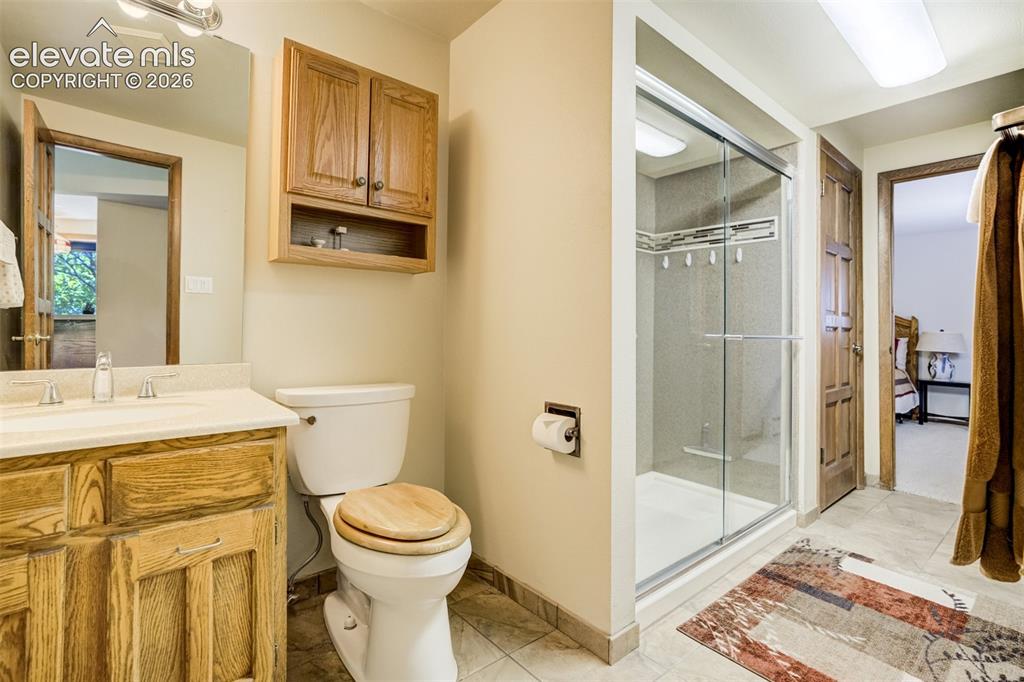 Image 40 of 50: Lower level bath may be accessed from family room or bedroom 4.