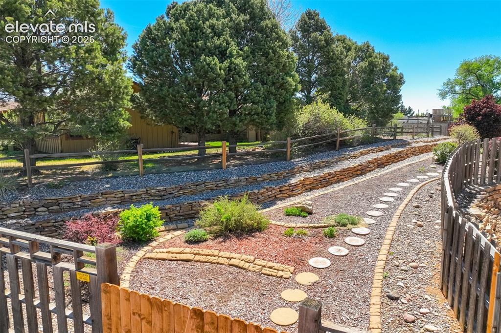 Image 47 of 50: Beautiful plantings in zeriscaped yard.