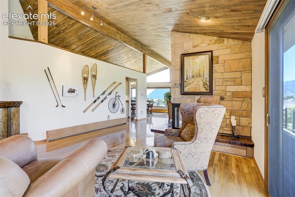 Image 8 of 50: Sitting room with 3-sided fireplace