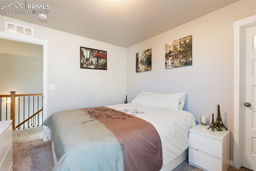 Image 17 of 33: Upper-level bedroom (alternate view).