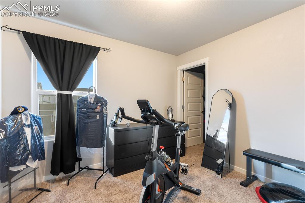 Image 18 of 33: Upper-level bedroom with flexible layout.