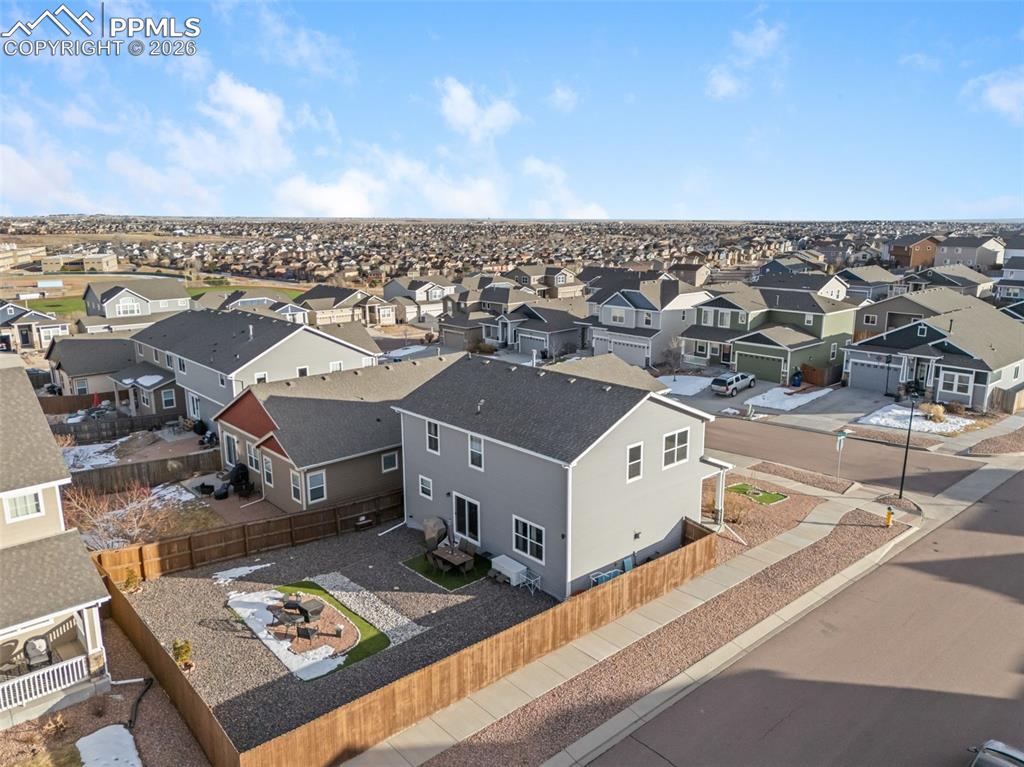 Image 28 of 33: Aerial view of surrounding neighborhood.