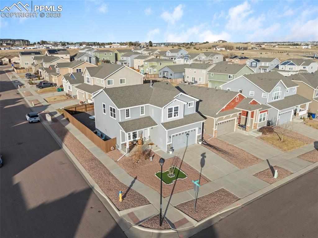 Image 30 of 33: Aerial view highlighting corner-lot setting.