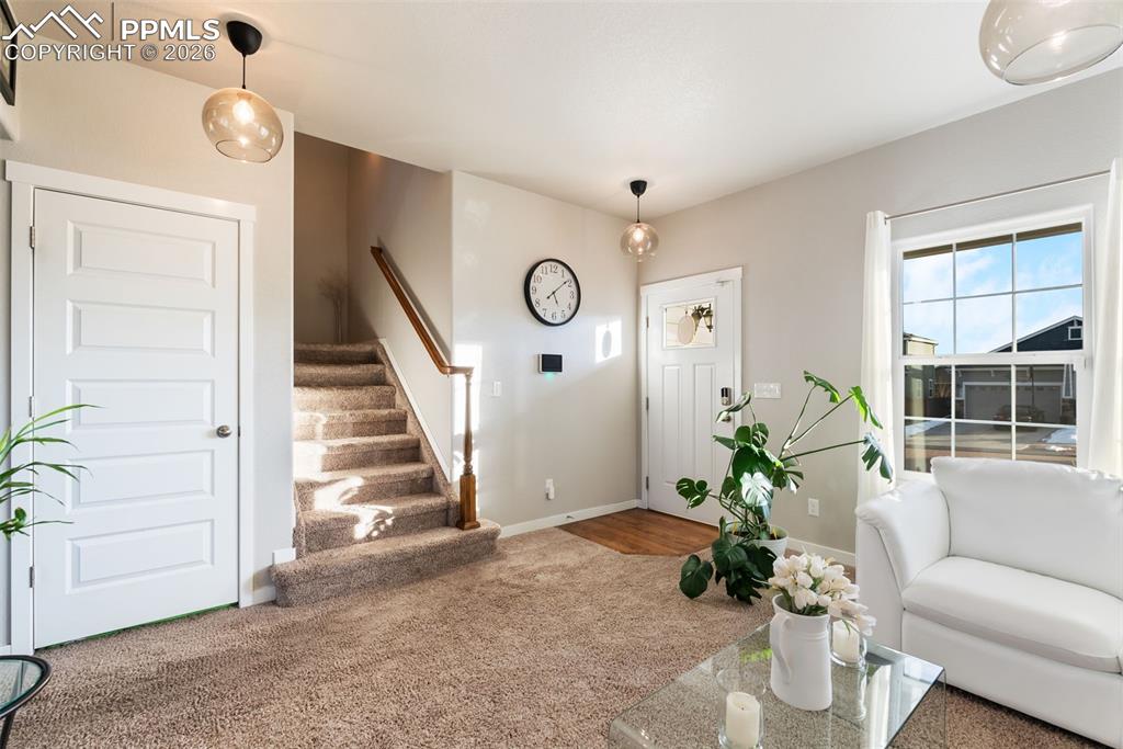 Image 5 of 33: Welcoming entry with stair access.