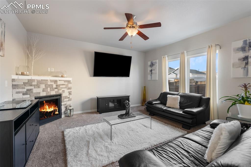 Image 7 of 33: Spacious living room with updated brick built-in fireplace.