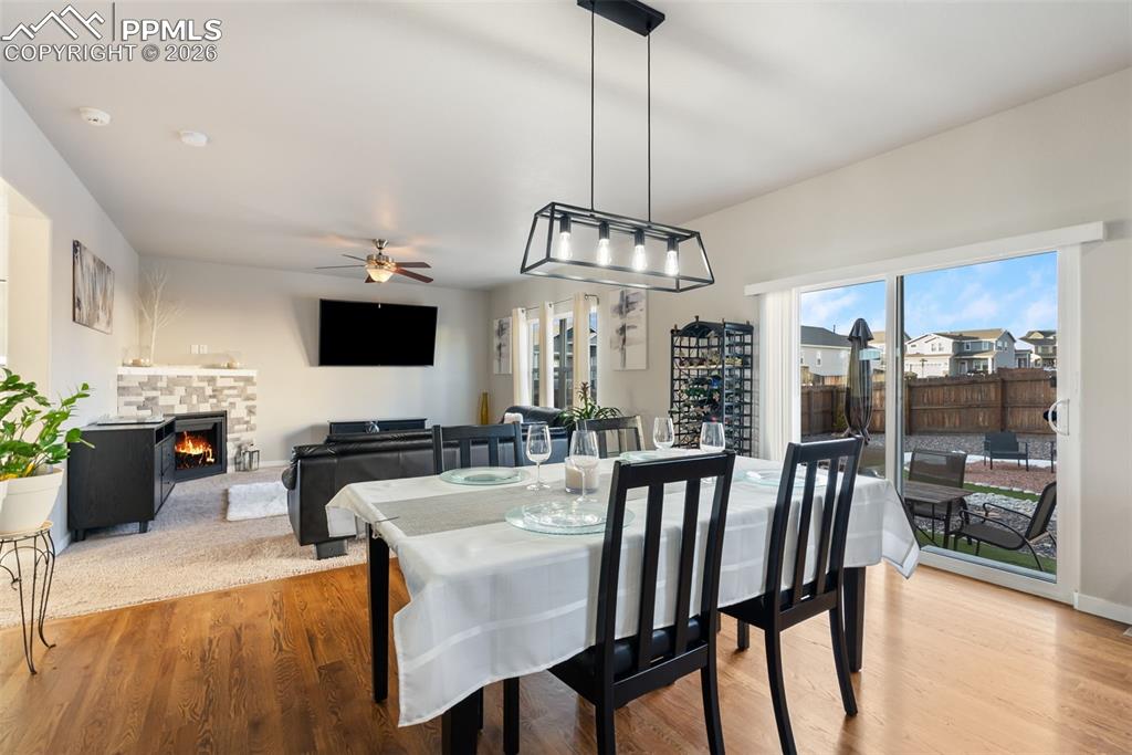 Image 8 of 33: Dining area with sliding doors to backyard.