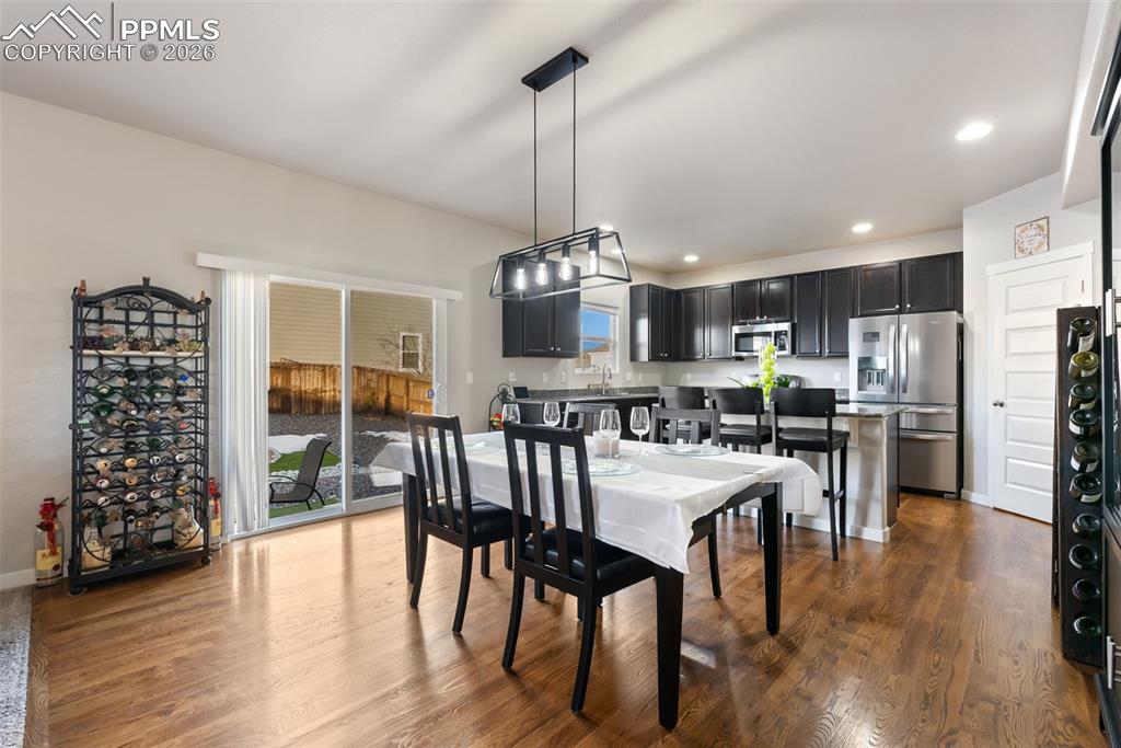 Image 9 of 33: Dining area open to kitchen.