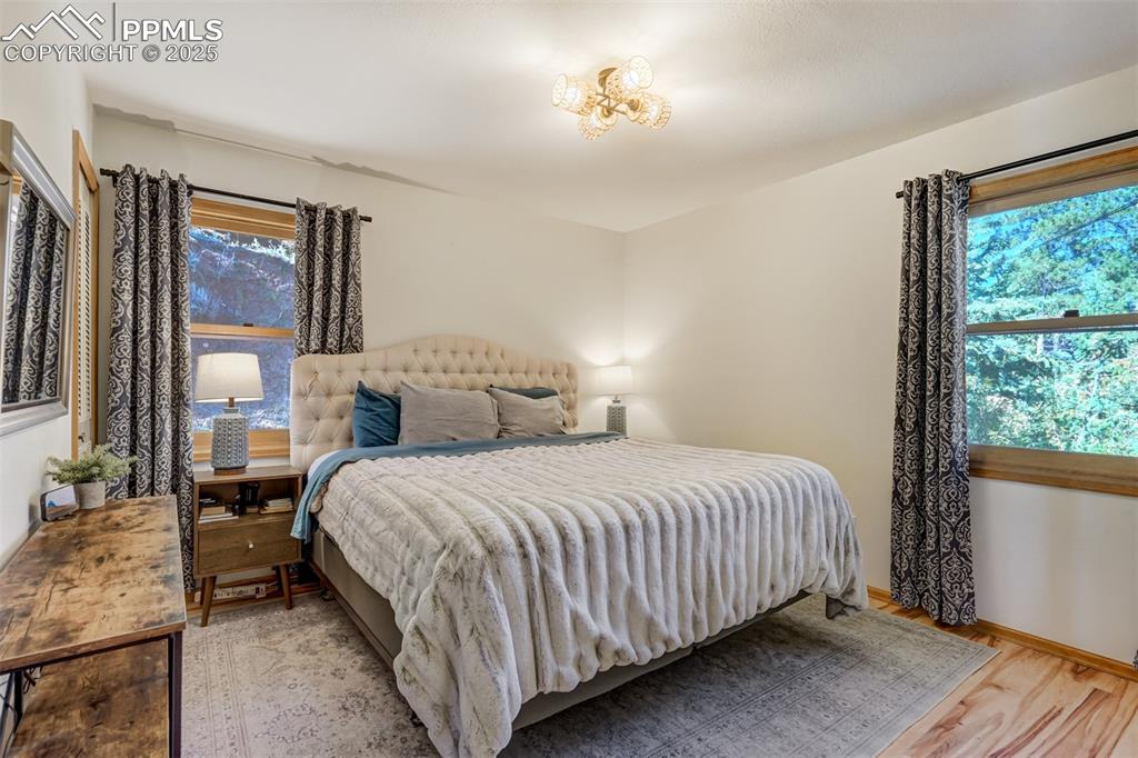 Image 12 of 50: Unit A - Bedroom #1 with double closets and a built in organizer.