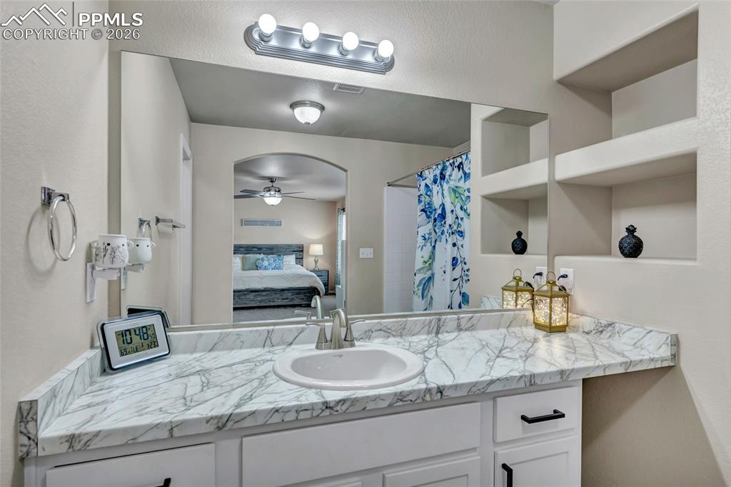 Image 22 of 38: Master Bath - double vanity & built-ins