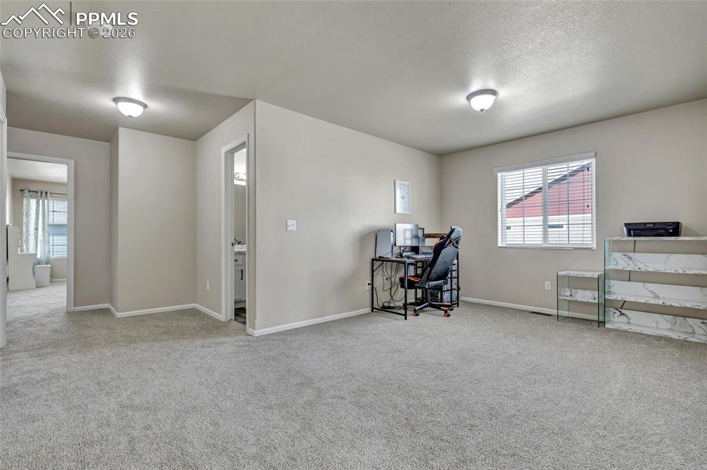 Image 24 of 38: Loft - office, crafts, play area, etc..