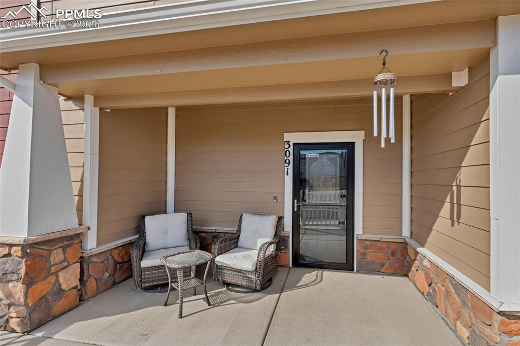 Image 3 of 38: Large covered & fenced front patio