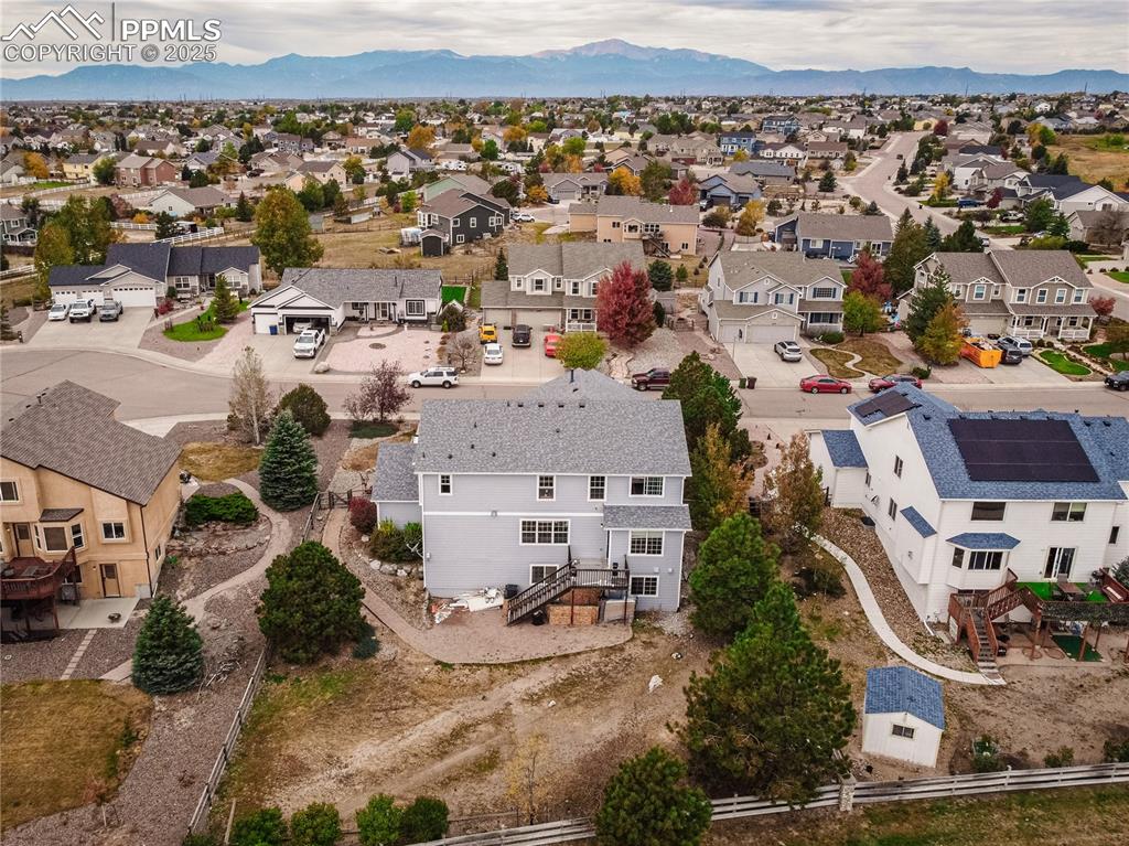 Image 40 of 47: Aerial perspective of suburban area with mountains