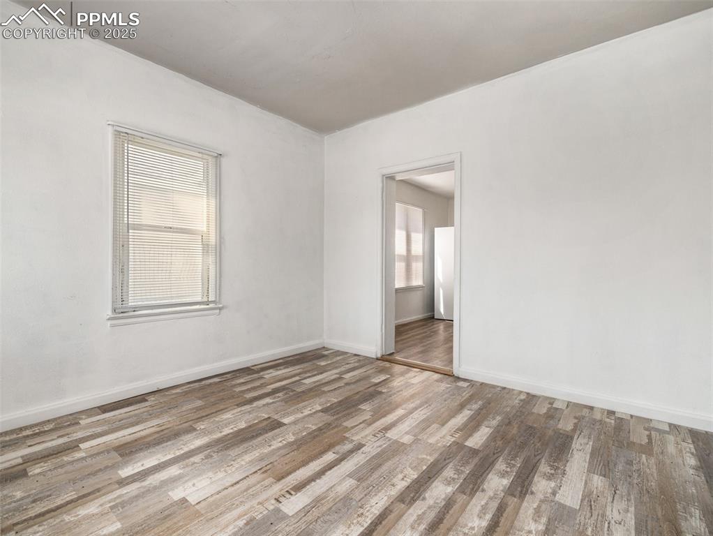 Image 19 of 30: featuring wood finished floors and baseboards
