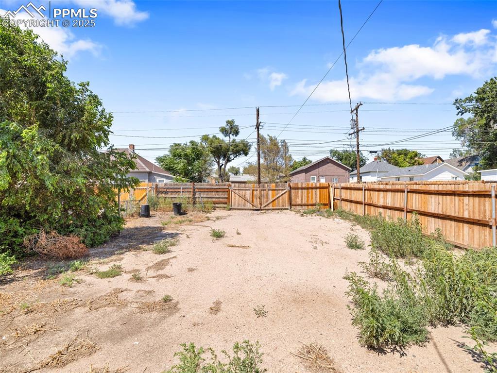 Image 3 of 30: View of yard with a gate