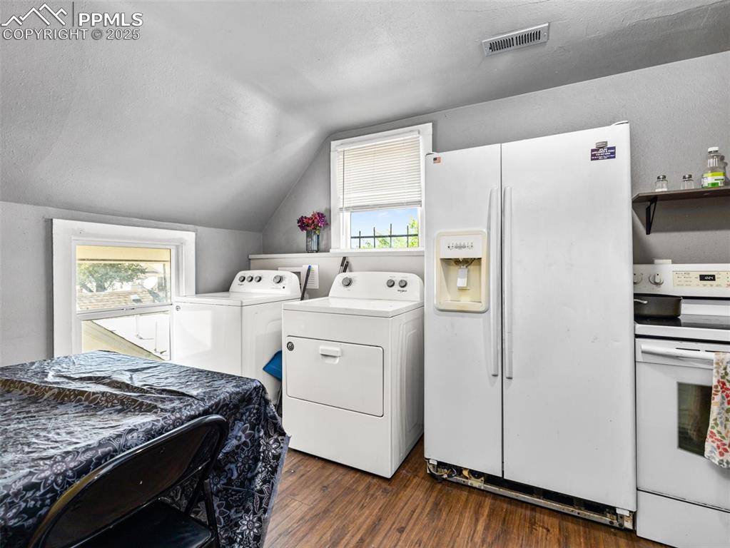 Image 9 of 30: Washroom featuring dark wood finished floors, a textured ceiling, and washi