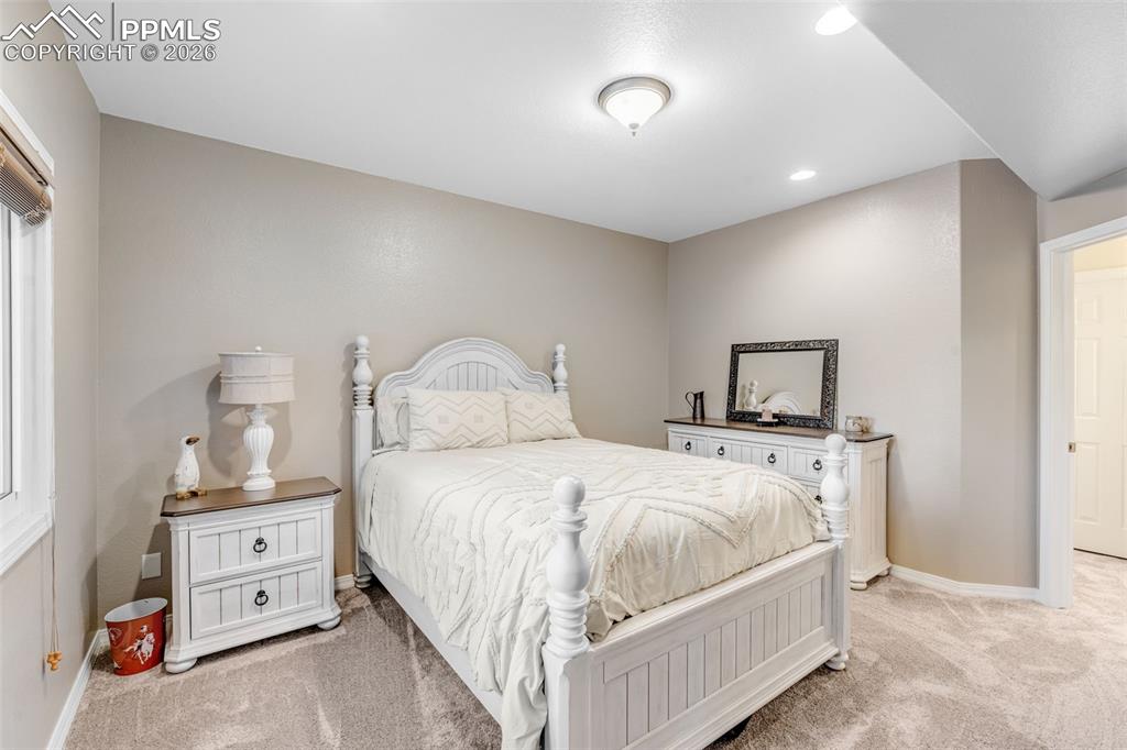 Image 34 of 50: Basement Bedroom w/Adjoining Bath
