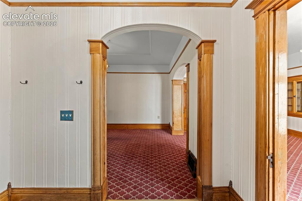 Image 9 of 47: Dining room with interior stairs to upper apartment