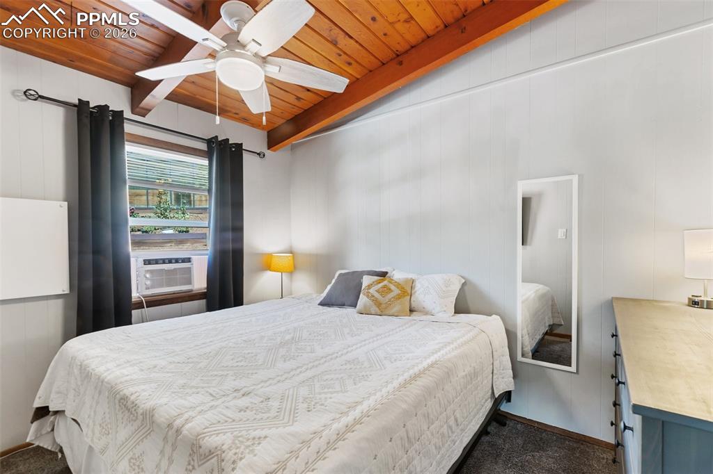 Image 15 of 46: Bedroom 1, ceiling fan and window AC included