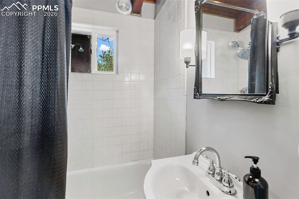 Image 17 of 46: Bathroom featuring shower / tub combo