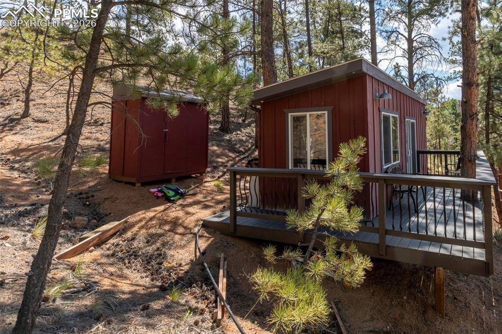 Image 21 of 46: 2nd structure behind main house, and storage shed