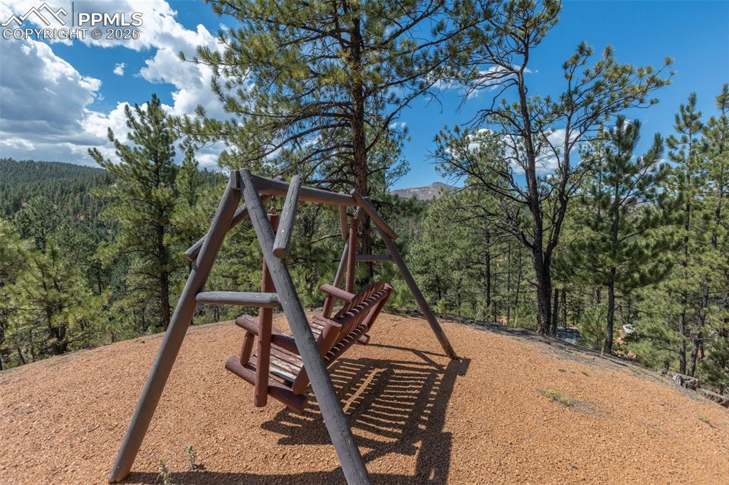 Image 38 of 46: Swing at top of the property with views