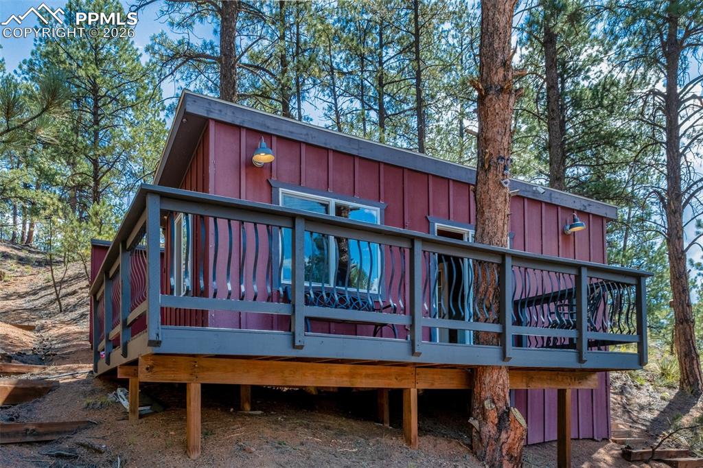 Image 6 of 46: Studio with deck behind main house