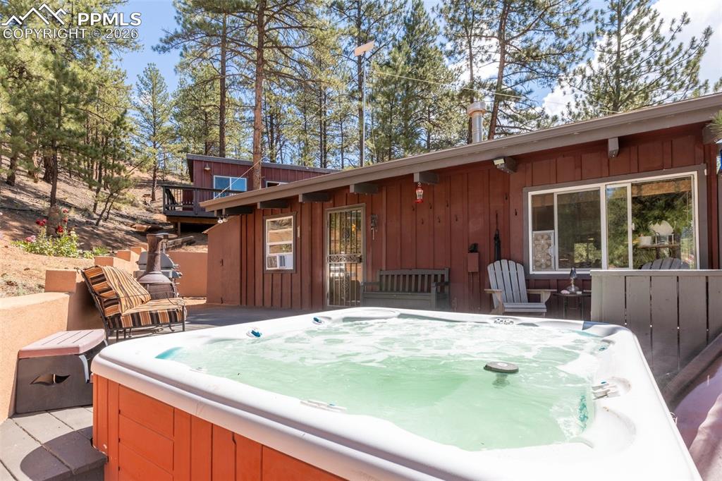 Image 8 of 46: Wooden terrace with a hot tub
