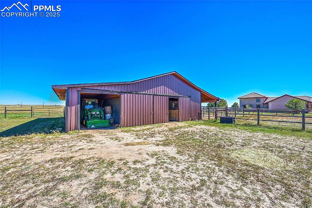 Image 14 of 49: Barn for equipment, stores feed, hay, livestock