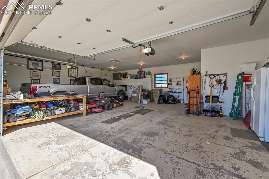 Image 44 of 49: Oversized 3 Car Garage-fits your big truck and all the toys