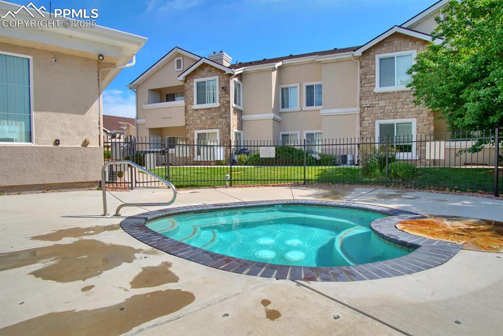 Image 24 of 36: Community clubhouse and hot tub