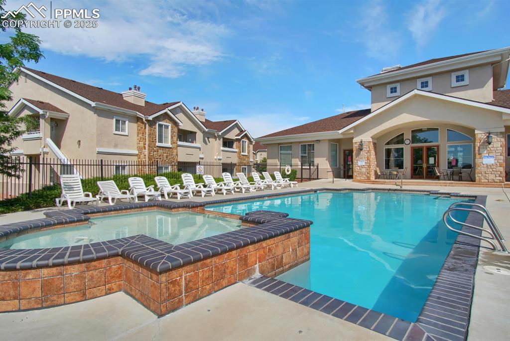 Image 25 of 36: Community clubhouse and pool