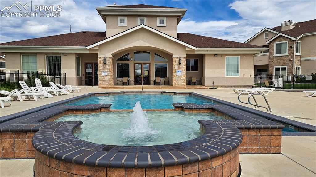 Image 26 of 36: Community clubhouse and pool